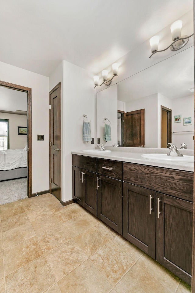 1408 72nd Ave S, Fargo, ND 58104 - ensuite bathroom featuring double vanity and tile patterned floors