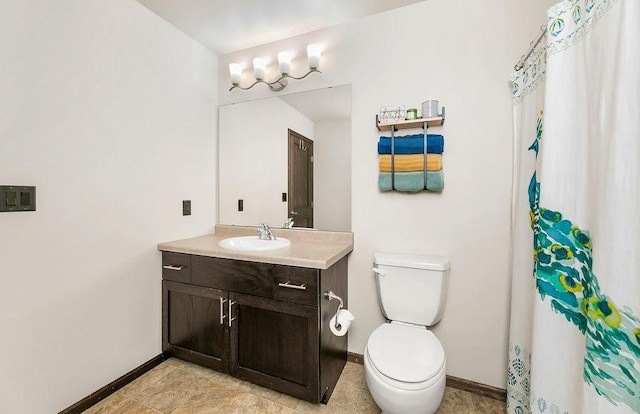 1408 72nd Ave S, Fargo, ND 58104 - bathroom featuring vanity, toilet, baseboards, and a shower with shower curtain