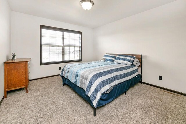 1408 72nd Ave S, Fargo, ND 58104 - bedroom with carpet and baseboards