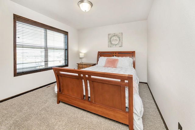 1408 72nd Ave S, Fargo, ND 58104 - bedroom featuring light colored carpet and baseboards