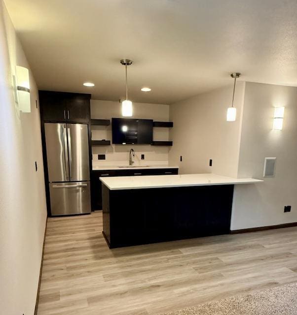 1408 72nd Ave S, Fargo, ND 58104 - kitchen featuring freestanding refrigerator, open shelves, light countertops, baseboards, and recessed lighting