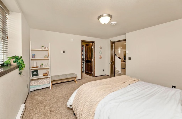 1408 72nd Ave S, Fargo, ND 58104 - bedroom with light colored carpet, a baseboard heating unit, and baseboards