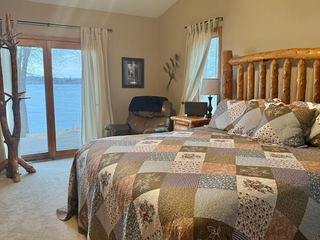 carpeted bedroom featuring access to outside and lofted ceiling