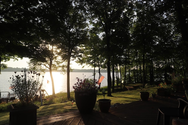 exterior space featuring a deck with water view