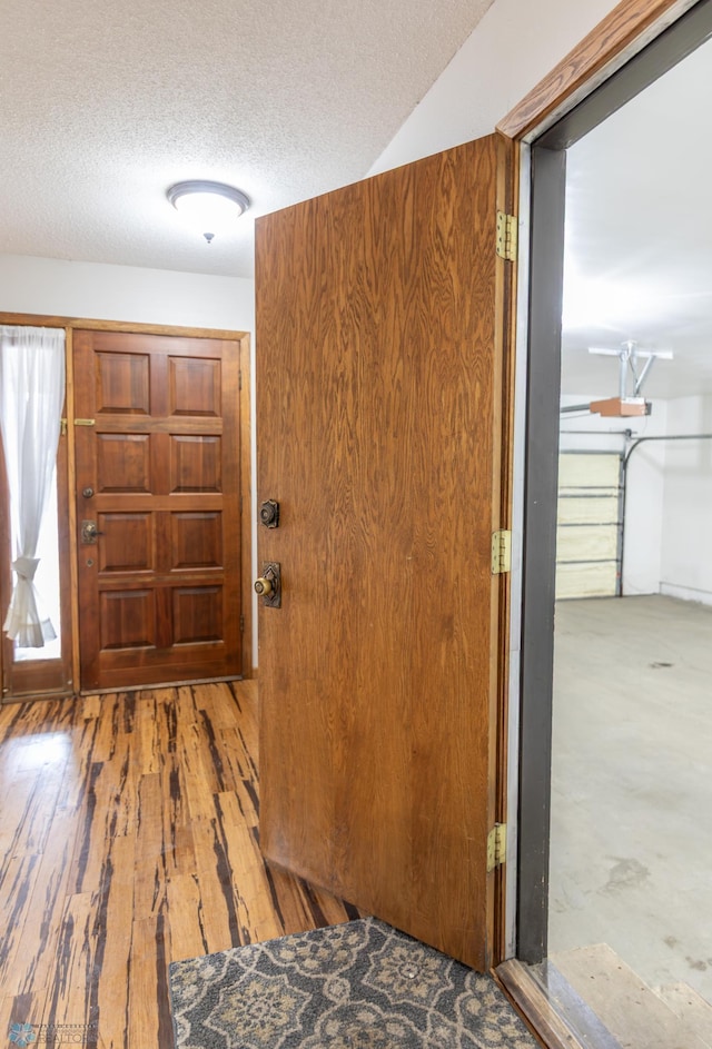 1611 32nd St S, Fargo, ND 58103 - entrance foyer featuring wood finished floors and a textured ceiling