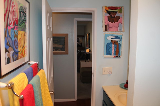 interior space featuring baseboards and vanity