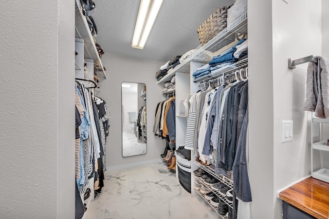 502 Seminole Ave, Osceola, WI 54020 - walk in closet featuring marble look tiles and arched walkways