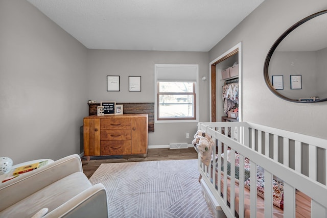 502 Seminole Ave, Osceola, WI 54020 - bedroom featuring wood finished floors and baseboards