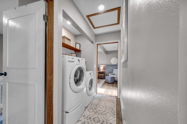 502 Seminole Ave, Osceola, WI 54020 - laundry area featuring washer and clothes dryer and wood finished floors
