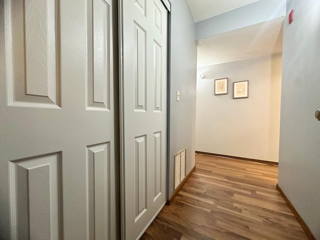 4120 Parklawn Ave Unit 134, Edina, MN 55435 - hallway featuring visible vents, baseboards, and wood finished floors