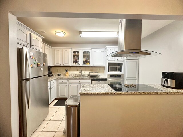 4120 Parklawn Ave Unit 134, Edina, MN 55435 - kitchen with a sink, white cabinetry, stainless steel appliances, island range hood, and light stone counters