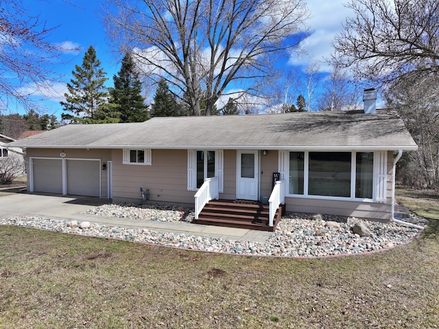 612 Woodland Ave, Park Rapids, MN 56470 - ranch-style house with a front yard, an attached garage, a chimney, and concrete driveway