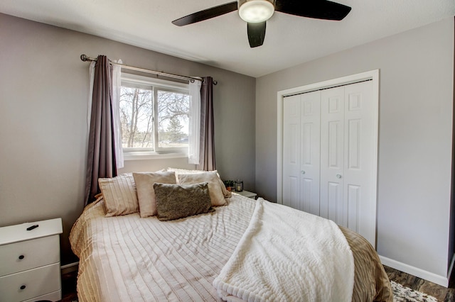612 Woodland Ave, Park Rapids, MN 56470 - bedroom featuring baseboards, a ceiling fan, wood finished floors, and a closet