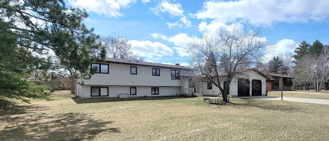 100 Park Rd, Staples, MN 56479 - back of property with concrete driveway, a yard, and an attached garage