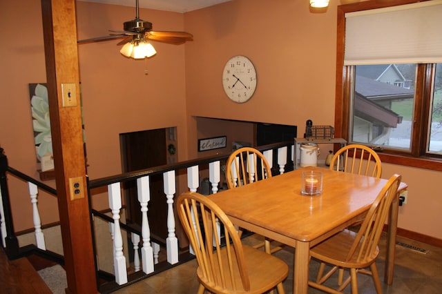 100 Park Rd, Staples, MN 56479 - dining room featuring baseboards, a ceiling fan, and stairway