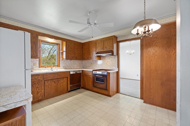 kitchen featuring dishwashing machine, a chandelier, a sink, range, and light countertops