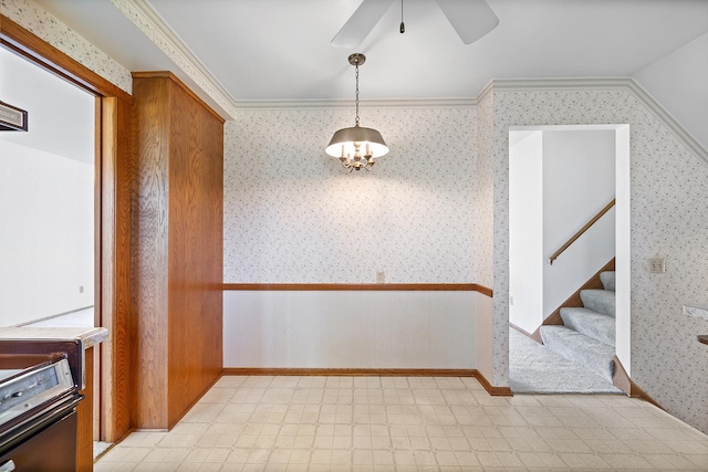 unfurnished dining area with wallpapered walls, stairway, a ceiling fan, and light floors