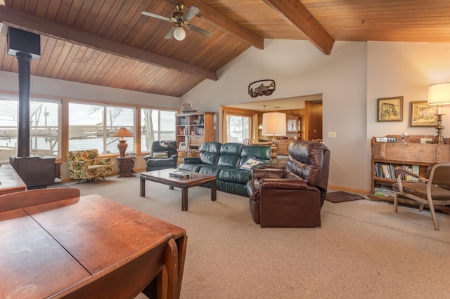 8236 Lake Carlos Dr NE, Carlos, MN 56319 - carpeted living room with a wood stove, ceiling fan, wooden ceiling, and baseboards