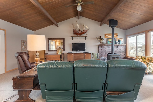 8236 Lake Carlos Dr NE, Carlos, MN 56319 - carpeted living room with wood ceiling, a wood stove, a ceiling fan, and baseboards