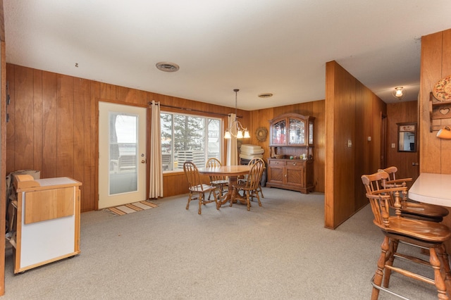 8236 Lake Carlos Dr NE, Carlos, MN 56319 - dining space with wooden walls and carpet floors