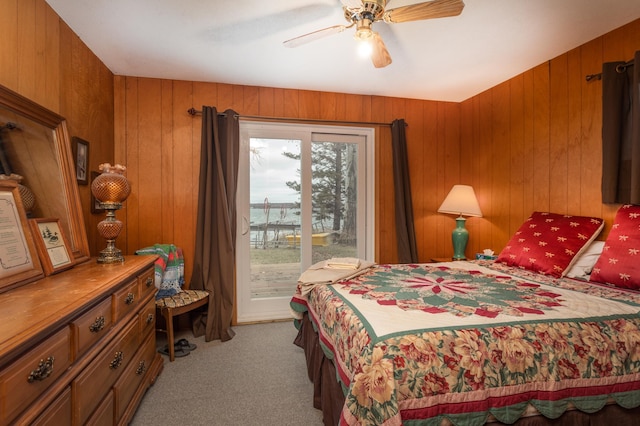 8236 Lake Carlos Dr NE, Carlos, MN 56319 - bedroom featuring carpet flooring, access to outside, wood walls, and a ceiling fan