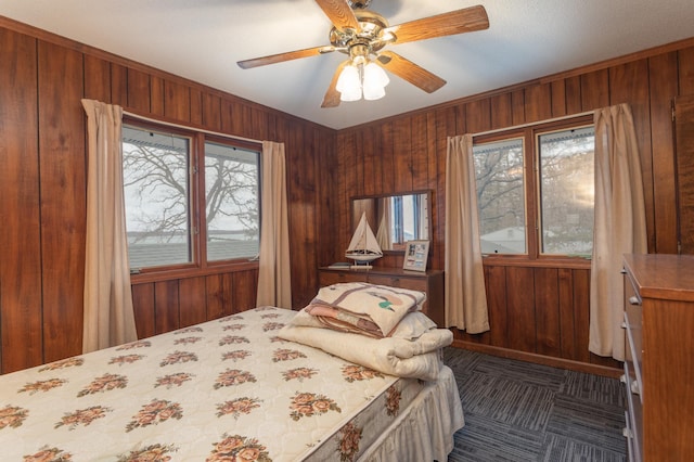 8236 Lake Carlos Dr NE, Carlos, MN 56319 - bedroom featuring wooden walls and a ceiling fan