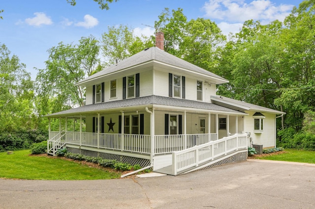 3220 50th Ave, Cady Twp, WI 54749 - farmhouse with covered porch, a chimney, a front lawn, and roof with shingles