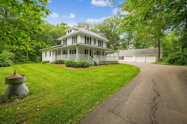 3220 50th Ave, Cady Twp, WI 54749 - view of front of home featuring covered porch, a detached garage, a front yard, and a chimney