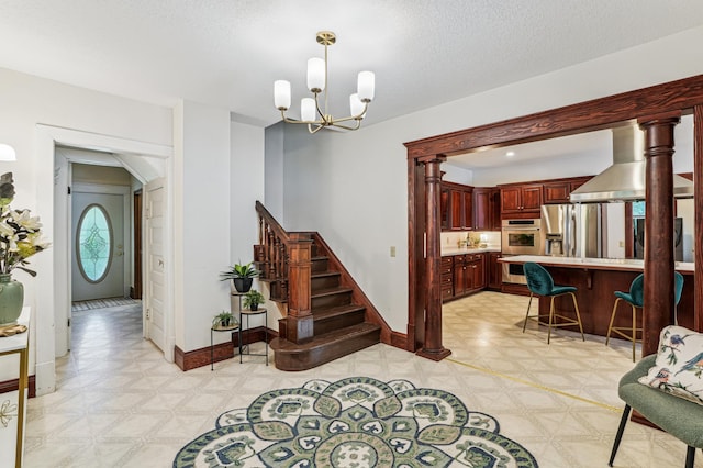 3220 50th Ave, Cady Twp, WI 54749 - foyer entrance featuring light floors, a chandelier, baseboards, and stairs