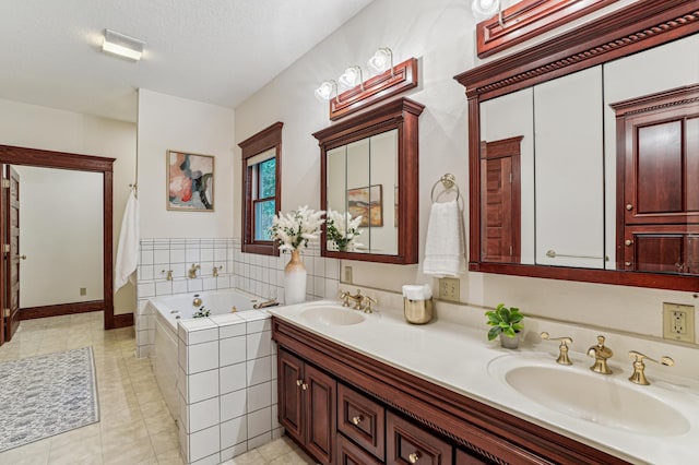 3220 50th Ave, Cady Twp, WI 54749 - full bath featuring double vanity, a tub with jets, a textured ceiling, and tile patterned flooring