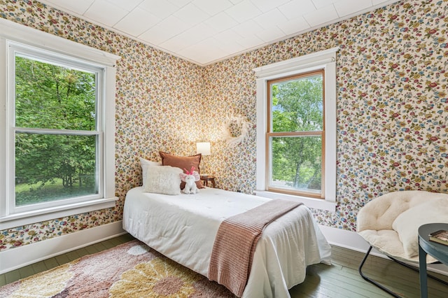 3220 50th Ave, Cady Twp, WI 54749 - bedroom featuring hardwood / wood-style floors, wallpapered walls, and baseboards