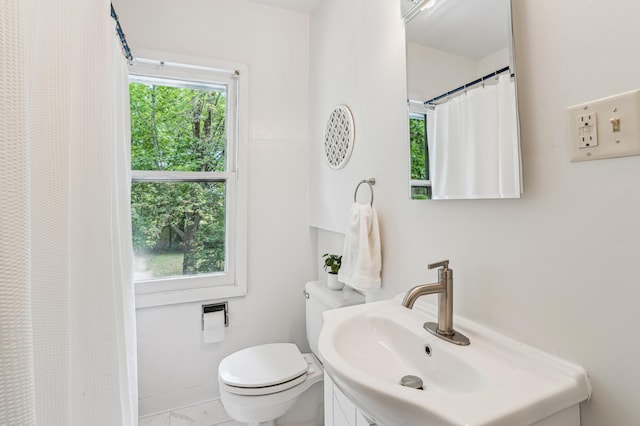 3220 50th Ave, Cady Twp, WI 54749 - bathroom featuring toilet, vanity, marble look tile flooring, and a shower with curtain