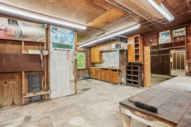 3220 50th Ave, Cady Twp, WI 54749 - basement featuring wood walls, a sink, and a heating unit