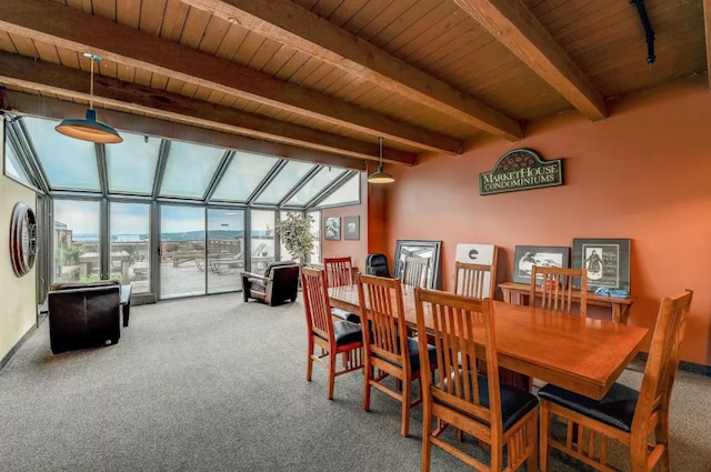 dining space with a sunroom, wood ceiling, beamed ceiling, and carpet floors