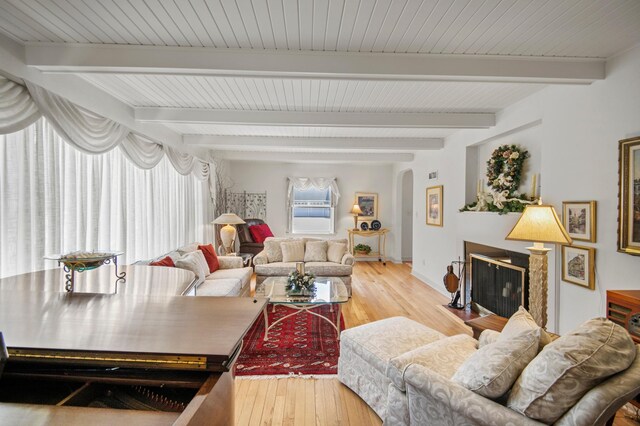 240 S St S, Owatonna, MN 55060 - living area with arched walkways, wood-type flooring, beamed ceiling, and baseboards