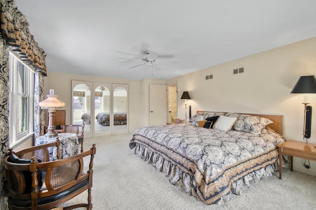 carpeted bedroom featuring french doors and ceiling fan