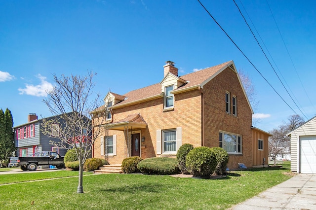 view of front facade featuring brick siding, a garage, a chimney, a front lawn, and a shingled roof