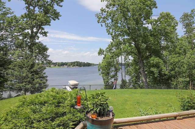 property view of water featuring fence