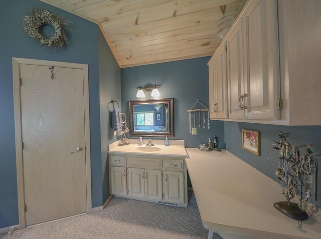 bathroom with vanity, baseboards, lofted ceiling, and wood ceiling