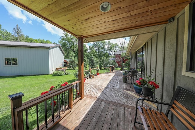 wooden deck featuring a yard
