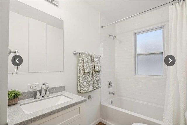 bathroom featuring vanity and shower / tub combo with curtain