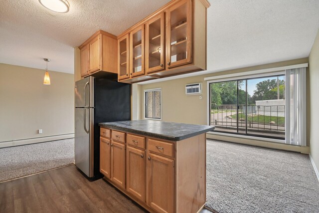 4110 Rahn Rd Unit 124, Eagan, MN 55122 - kitchen featuring freestanding refrigerator, a baseboard radiator, dark countertops, glass insert cabinets, and a textured ceiling