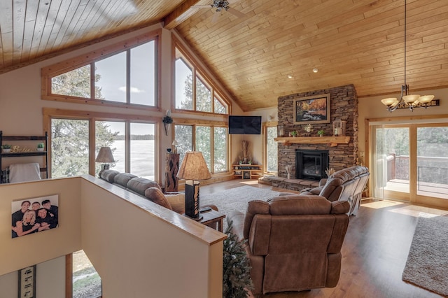 31690 Large Pine Trl, Laporte, MN 56461 - living area with wooden ceiling with exposed beams, a stone fireplace, a chandelier, high vaulted ceiling, and wood finished floors