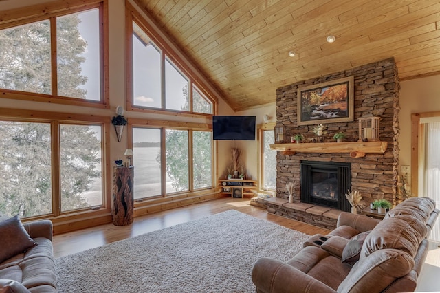 31690 Large Pine Trl, Laporte, MN 56461 - living area featuring wood ceiling, high vaulted ceiling, a stone fireplace, and wood finished floors