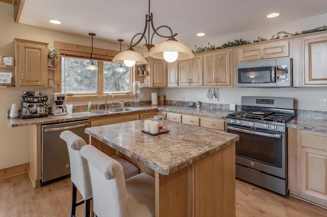 31690 Large Pine Trl, Laporte, MN 56461 - kitchen with appliances with stainless steel finishes, a sink, light brown cabinets, light wood-style floors, and recessed lighting