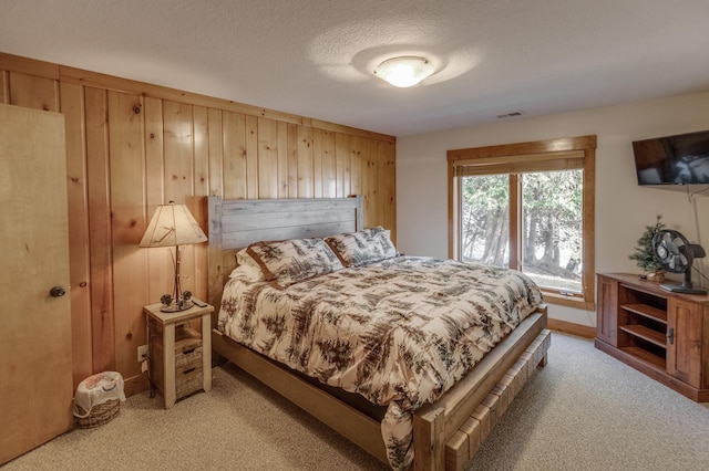 31690 Large Pine Trl, Laporte, MN 56461 - bedroom featuring light carpet, wooden walls, and a textured ceiling