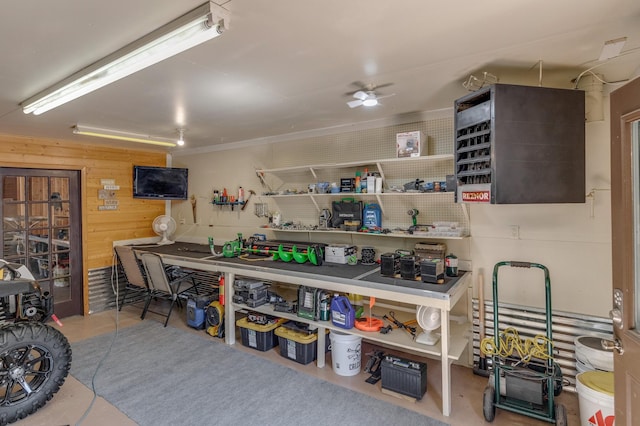 31690 Large Pine Trl, Laporte, MN 56461 - garage featuring a workshop area, wood walls, and a ceiling fan