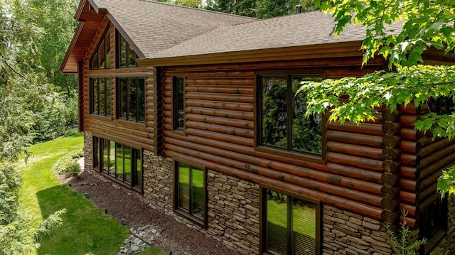31690 Large Pine Trl, Laporte, MN 56461 - view of home's exterior with roof with shingles, log siding, and stone siding
