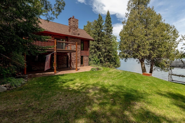 31690 Large Pine Trl, Laporte, MN 56461 - view of green lawn featuring a patio area, a deck with water view, and stairway