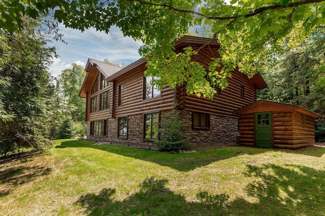 31690 Large Pine Trl, Laporte, MN 56461 - view of home's exterior featuring a yard, stone siding, and log exterior